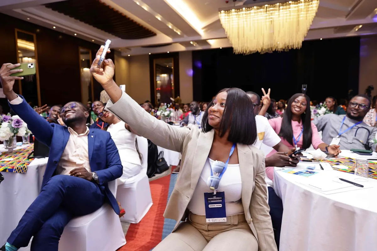 Delegates taking selfies during the summit
