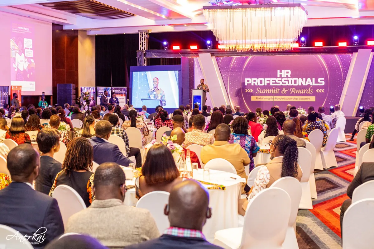 A speaker addressing a full room at the HR Professionals Summit & Awards